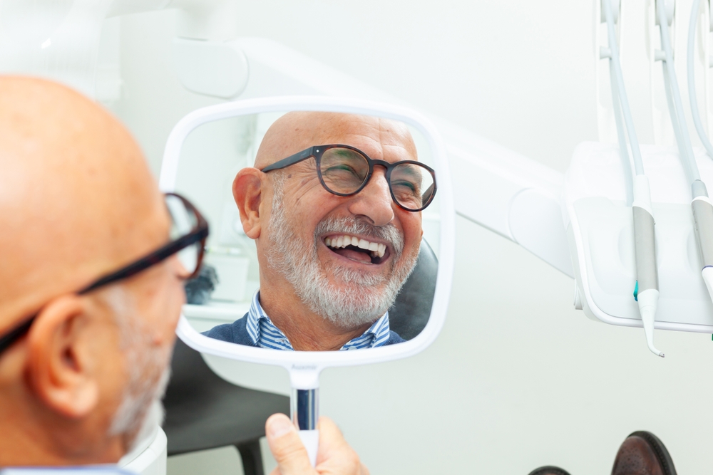 A Patient's Guide to the Dental Implant Procedure in Davis, CA. Dr. Amir Nojouimi, Dr. Pouya Namiranian. Davis Oral Surgery & Implant Center